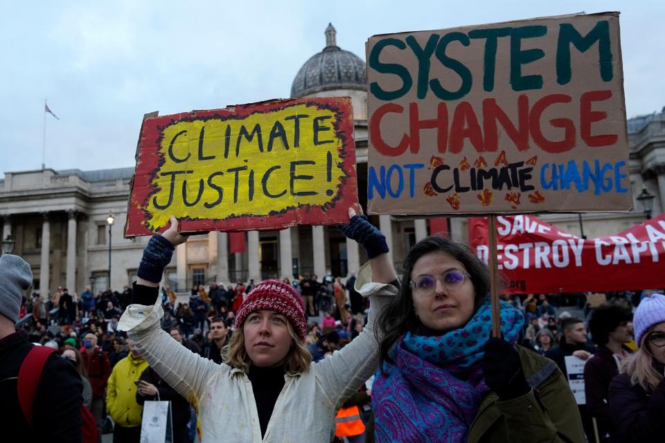 Protesters gather in Trafalgar Square having marched into central London from the City of London during a global day of action on climate change on November 6, 2021, during the COP26 UN Climate Change Conference, taking place in Glasgow. - From Paris to Sydney, Nairobi to Seoul, more than 200 events are planned worldwide to demand immediate action for communities already affected by climate change, particularly in the poorer countries in the South. (Photo by Niklas HALLE'N / AFP) (Photo by NIKLAS HALLE'N/AFP via Getty Images)