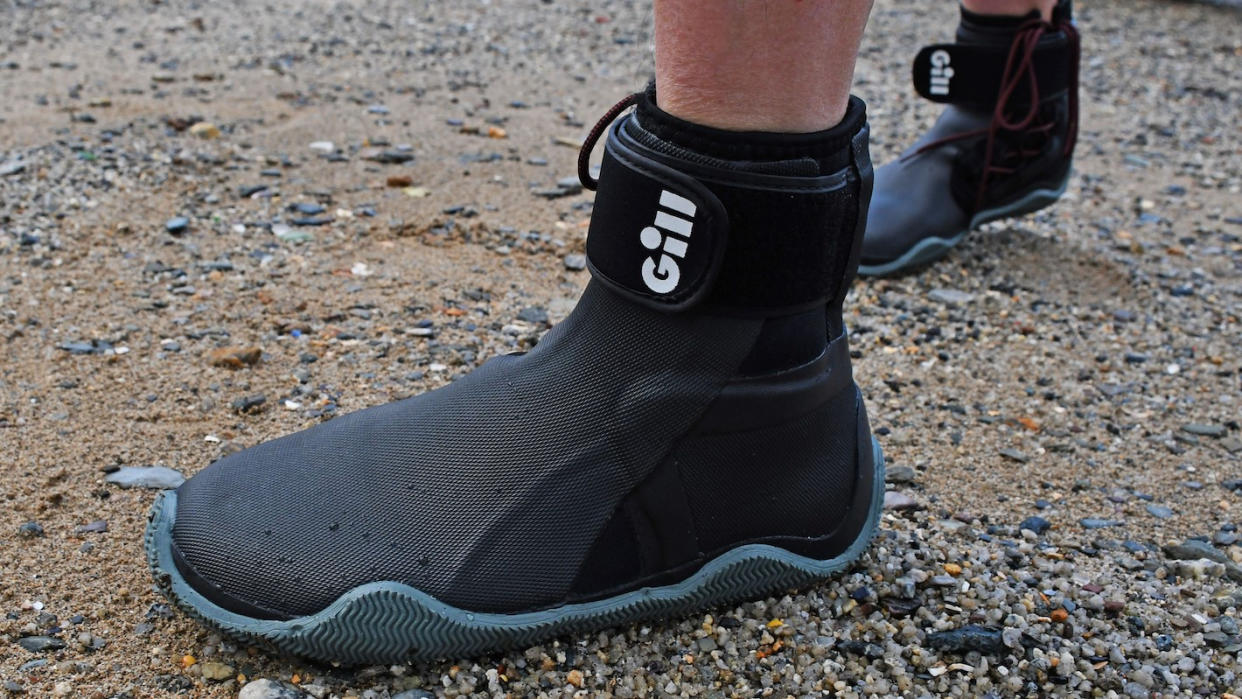  Person's feet wearing Gill Marine Edge boots 