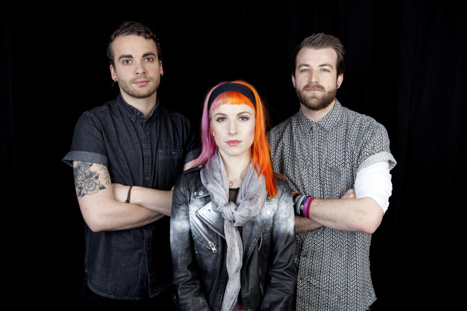 This April 8, 2013 photo shows from left, Taylor York, Hayley Williams and Jeremy Davis, of the American rock band Paramore posing for a portrait in New York. (Photo by Amy Sussman/Invision/AP)