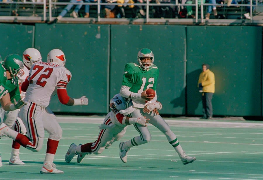 Philadelphia Eagles quarterback Randal Cunningham is sacked by St. Louis Cardinals’ Freddie Joe Nunn for a six yard loss during first quarter action of NFL game at Philadelphia’s Veterans Stadium, Nov. 22, 1987. (AP Photo/George Widman)