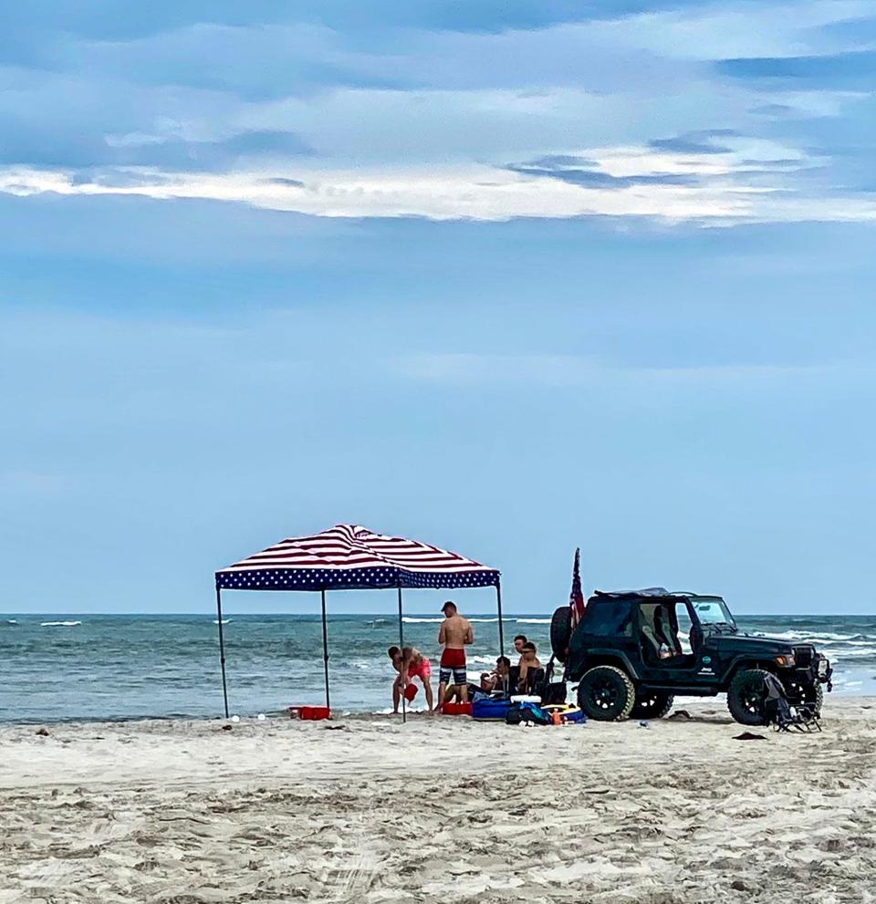 Topsail Island still offers driving on the beach which makes for a convenient and fun afternoon getaway. Driving on the beach incurs a small fee payable at the beach access. This scene is from the New River Inlet on Topsail Island.  [John Althouse / The Daily News]