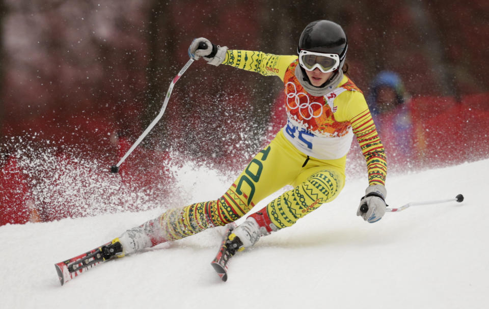 Togo's Alessia Afi Dipol makes a turn in the first run of the women's giant slalom at the Sochi 2014 Winter Olympics, Tuesday, Feb. 18, 2014, in Krasnaya Polyana, Russia. (AP Photo/Charles Krupa)