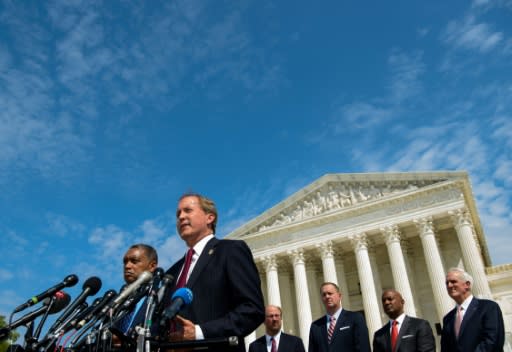 District of Columbia Attorney General Karl Racine (L) and Texas Attorney General Ken Paxton speak during the launch of an antitrust investigation into large tech companies outside of the US Supreme Court in Washington