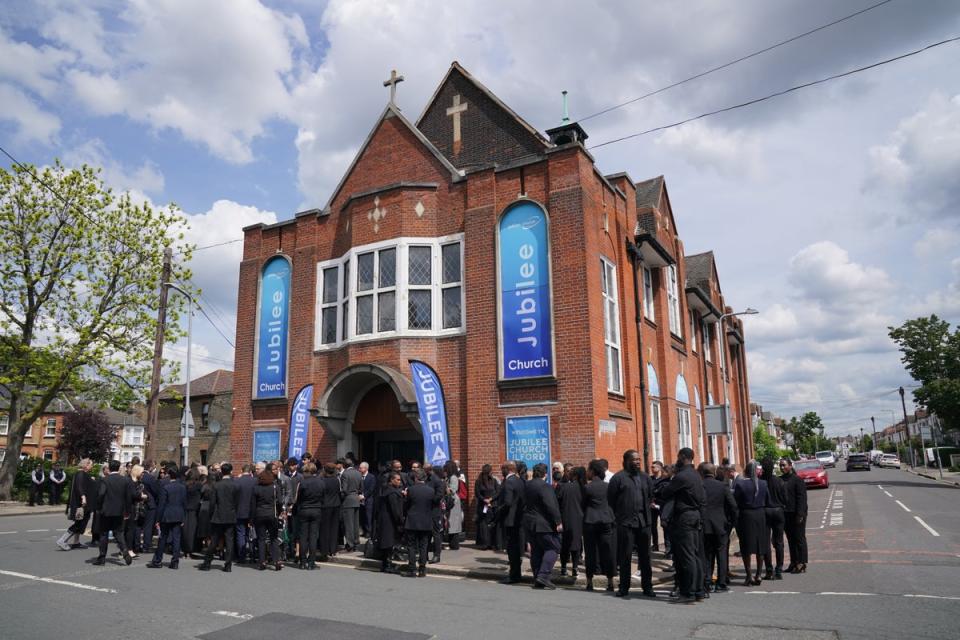 Mourners arriving at the funeral service (Jonathan Brady/PA Wire)