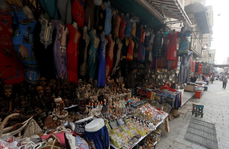 A shopkeeper waits for customers at a souvenir shop at a popular tourist area named "Khan el-Khalili" in the al-Hussein and Al-Azhar districts in Cairo