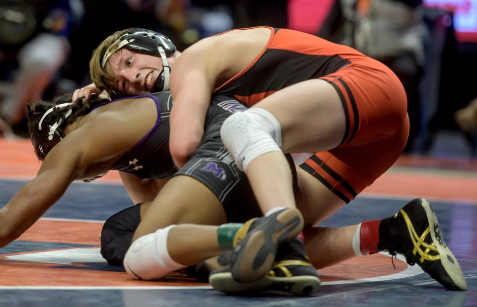 Washington's Kannon Webster tangles with Mascoutah's Santino Robinson in the Class 2A 132-pound state title match Saturday, Feb. 19, 2022 at the State Farm Center in Champaign.