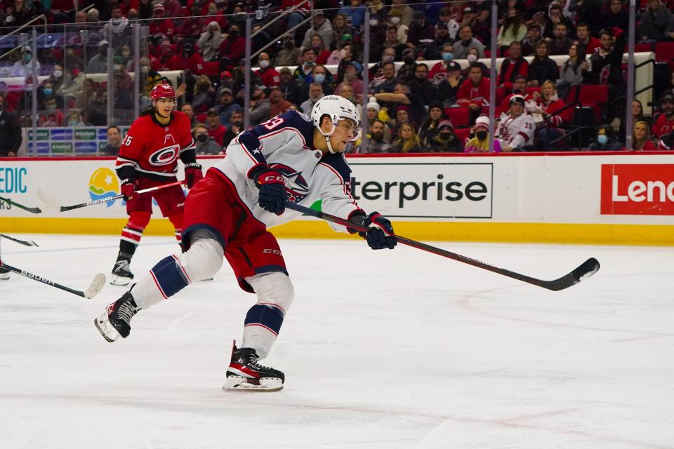 Jan 13, 2022; Raleigh, North Carolina, USA;  Columbus Blue Jackets right wing Yegor Chinakhov (59) scores a goal against the Carolina Hurricanes during the second period at PNC Arena. Mandatory Credit: James Guillory-USA TODAY Sports