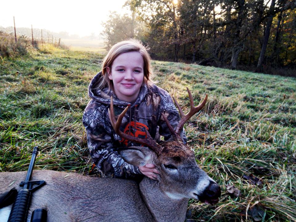 Makynna Gulick, 12, holds an 8-point buck she shot during the early youth portion of deer season Oct. 30, 2021.