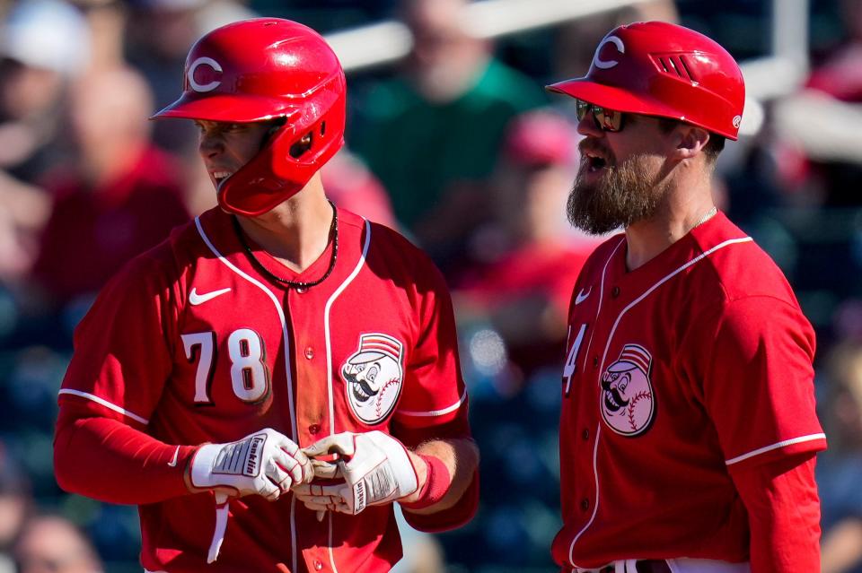 Cincinnati Reds shortstop Matt McLain (78) stands on first with first base coach Collin Cowgill. McLain has consistently gotten on base this spring to impress the coaching staff.