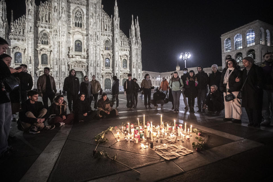 FILE - People attend a candlelight vigil for 22-year-old Giulia Cecchettin, allegedly killed at the hands of her possessive ex-boyfriend, in front of the Milan Duomo Cathedral, Italy, Sunday, Nov. 19, 2023. Outrage over violence against women is mounting in Italy, with students leading the way. Young people across the country have taken to pounding on classroom desks in unison to demand an end to the slayings of women by men and to root out corrosive, patriarchal attitudes that have long been a part of Italian society. Opposition lawmakers did the same in parliament. (Marco Ottico/LaPresse via AP, file)