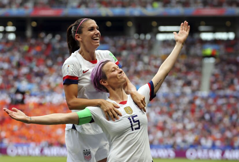 FILE - United States' Megan Rapinoe, right, celebrates after scoring the opening goal.