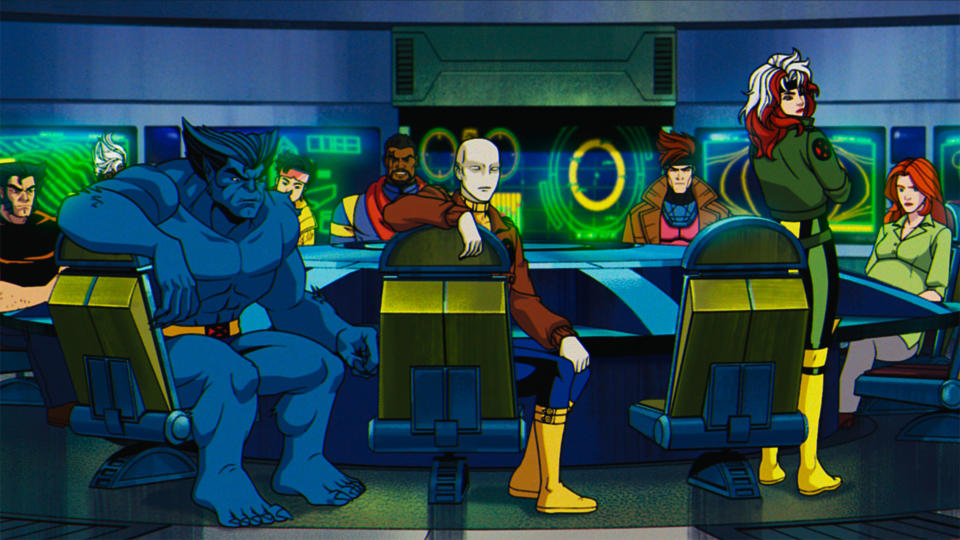 Wolverine, Beast, Jubilee, Bishop, Morph, Gambit, Rogue and Jean Grey in a briefing.