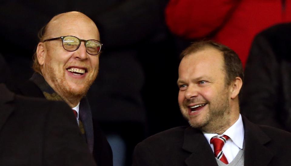 Joel Glazer, left, pictured with loyal executive Ed Woodward (PA)