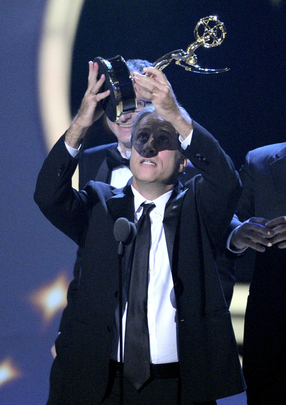 John Stewart and the crew of "The Daily Show with John Stewart" accept the award for outstanding variety, music, or comedy series for "The Daily Show with Jon Stewart" onstage at the 63rd Primetime Emmy Awards on Sunday, Sept. 18, 2011 in Los Angeles. (AP Photo/Mark J. Terrill)