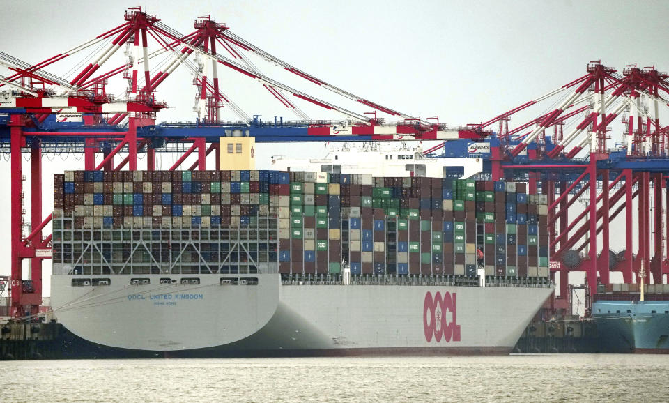 The 'OOCL United Kingdom' container vessel is anchored at the 'Jade Weserport' container terminal in Wilhelmshaven, Germany, Tuesday, Nov. 15, 2022. Hobbled by high interest rates, punishing inflation and Russia's war against Ukraine, the world economy is expected to eke out only modest growth this year and to expand even more tepidly in 2023. That was the sobering forecast issued Tuesday Nov. 22, 2023 by the Organization for Economic Cooperation and Development. In the OECD's estimation, the world economy will grow just 3.1% this year, down sharply from a robust 5.9% in 2021. (AP Photo/Michael Sohn, File)