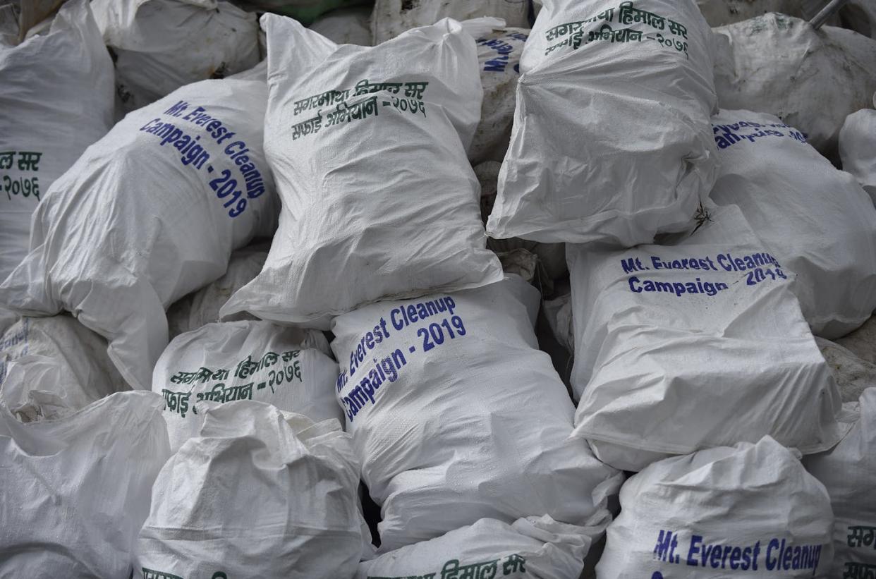 Trash collected in a 2019 cleanup that removed 24,000 pounds (10,000 kilograms) of garbage from Mount Everest. <a href="https://www.gettyimages.com/detail/news-photo/full-sack-of-waste-garbages-collected-from-mount-everest-news-photo/1148261373" rel="nofollow noopener" target="_blank" data-ylk="slk:Narayan Maharjan/NurPhoto via Getty Images;elm:context_link;itc:0;sec:content-canvas" class="link ">Narayan Maharjan/NurPhoto via Getty Images</a>