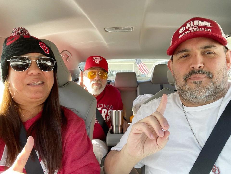 Juanita and Marc Rangel, front, and Jerry Lewis in back show who is No. 1 as they road trip from Kansas City, Missouri, to Orlando, Florida, where they plan to watch the Oklahoma Sooners compete against the Florida State University in the Cheez-It Bowl on Thursday. Provided