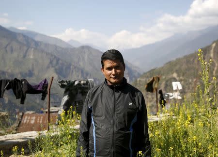 Toyanath Rijal, a telecoms engineer who survived the massive landslide triggered by last week's earthquake in Langtang village, poses for a photograph in Dhunche, Nepal, May 5, 2015. REUTERS/Olivia Harris