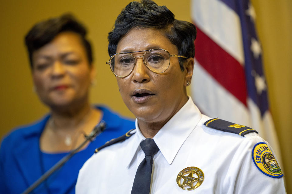 FILE - New Orleans Police Capt. Michelle Woodfork, right, is introduced as the new interim police superintendent during a press conference at New Orleans City Hall, Dec. 20, 2022. Mayor LaToya Cantrell listens at left. New Orleans District Attorney Jason Williams said Thursday, Feb. 23, 2023, that an assistant prosecutor wrongly decided to drop prosecution of more than a dozen illegal gun possession cases arising from Mardi Gras season arrests in exchange for the suspects' agreeing to forfeit their weapons. (Chris Granger/The Times-Picayune/The New Orleans Advocate via AP, File)