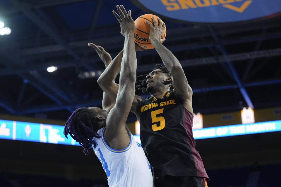 Arizona State guard Jamiya Neal (5) shoots over UCLA forward Kenneth Nwuba during the first half of an NCAA college basketball game Saturday, March 9, 2024, in Los Angeles. (AP Photo/Jae C. Hong)