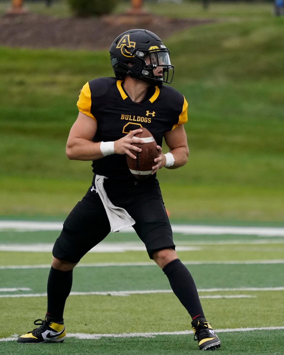 Adrian College quarterback Jack Wurzer drops back to pass during the Week 1 home against Heidleberg.