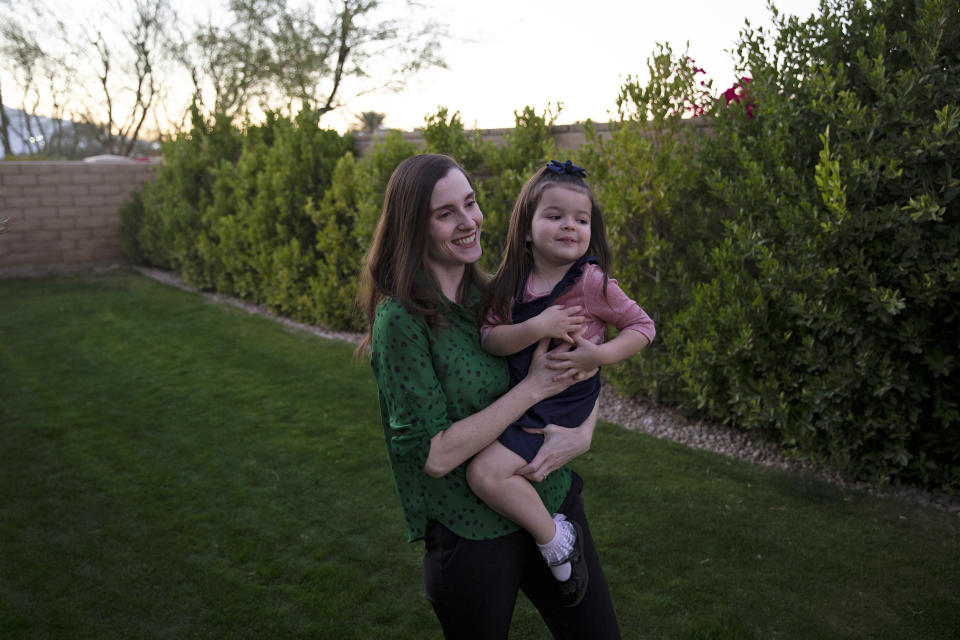 Image: Marilyn Jerominski holds Shia, 3, at their home in Indio, Calif., on Feb. 19, 2021. (Jenna Schoenefeld / NBC News)