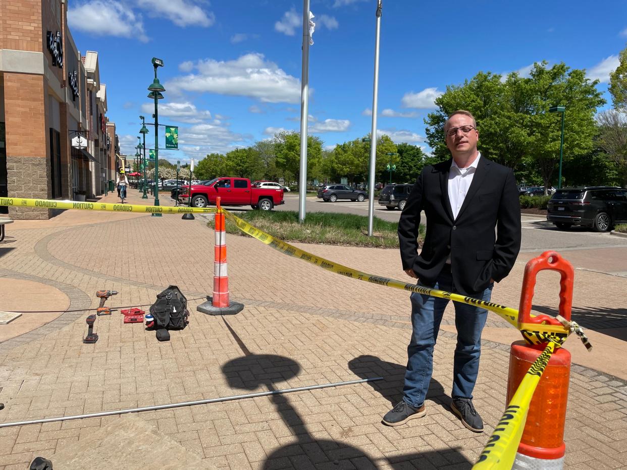 Sean Valentino, who manages Green Oak Village Place, talks about new stores coming soon to the outdoor shopping mall near Brighton, Tuesday, May 17, 2022.