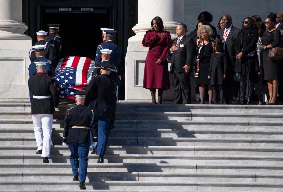 The casket of Rep. Elijah Cummings is carried by honor guard up the Capitol Hill steps where he will lie in state at a ceremony in Statuary Hall in the U.S. Capitol.
