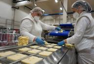 Employees work at Madeta dairy factory in Plana nad Luznici