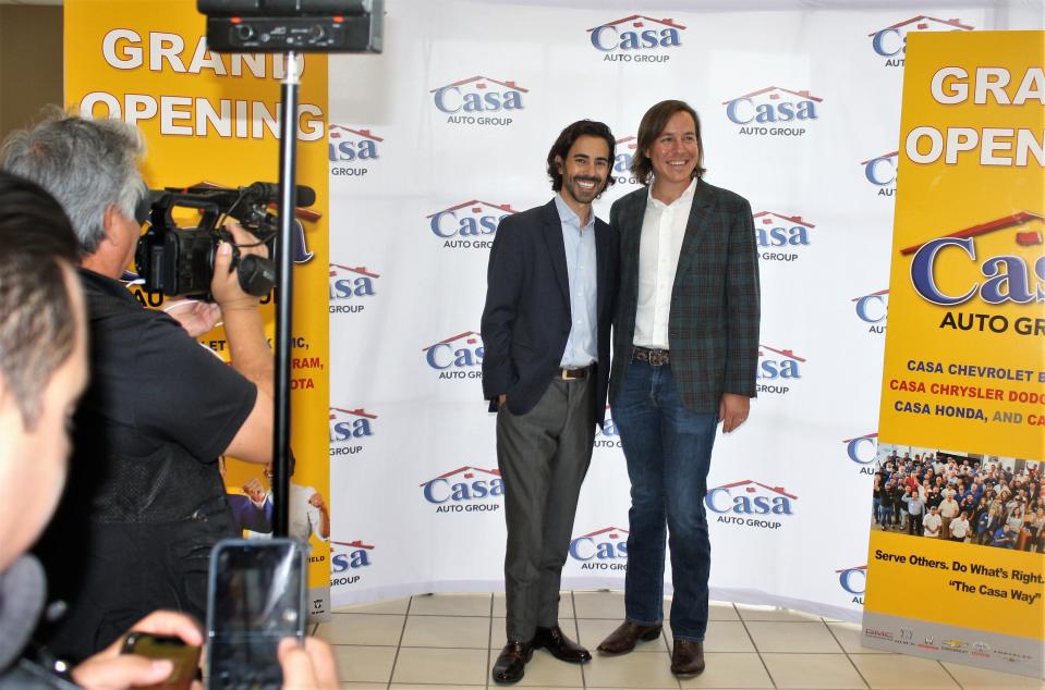 Luke, left, and Ronnie Lowenfield, who own the El Paso Casa Auto Group with their brother Justin, pose Wednesday at grand opening celebration of the four Alamogordo, New Mexico, dealerships Casa purchased from Desert Sun Motors.