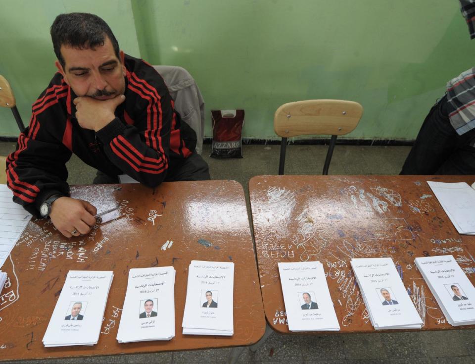 An electoral worker waits for voters to cast their ballots at a polling station in Algiers as part of the presidential elections, Thursday, April 17, 2014. Algerians trickled into voting booths on a sunshine-drenched Thursday to elect the president of this oil-rich North African nation in an election dominated by the ailing incumbent running for a fourth term. (AP Photo/Sidali djarboub)