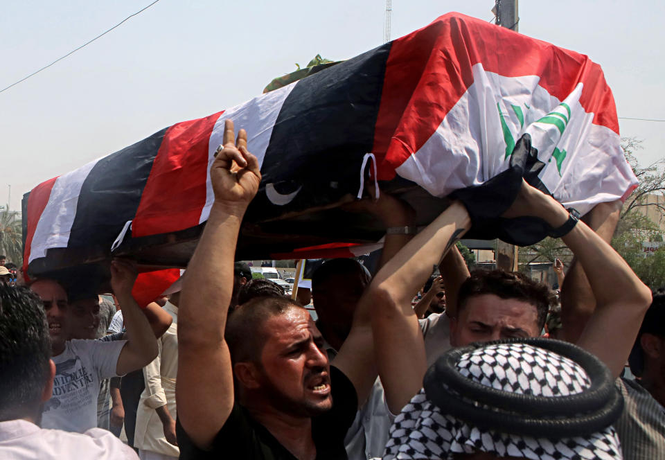 Mourners carry the Iraqi flag-draped coffin of Mekki Yasser, a protester whose family and activists said he was killed when he participated in a protest last night, during his funeral on Tuesday, Sept. 4, 2018, in Basra, about 340 miles (550 kilometers) southeast of Baghdad, Iraq. (AP Photo/Nabil al-Jurani)