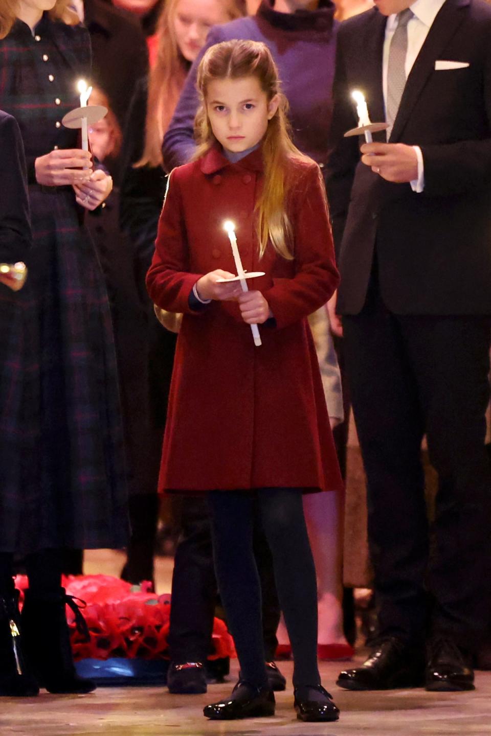 Princess Charlotte wears a cheerful red coat for the festive occasion (Chris Jackson/PA Wire)