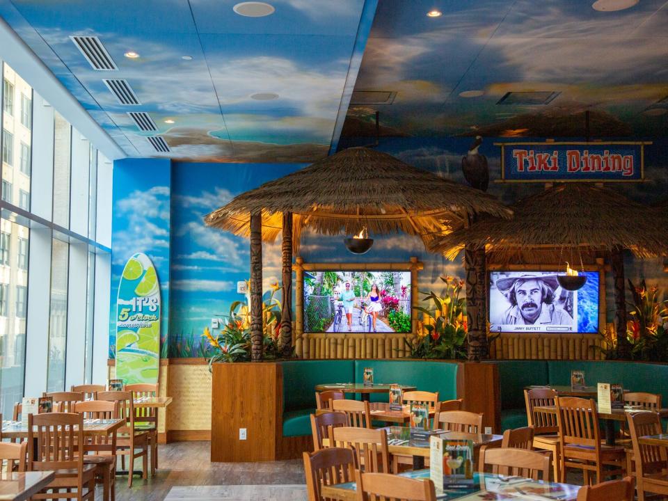 empty tables and TVs at the two-floor Margaritaville Restaurant.