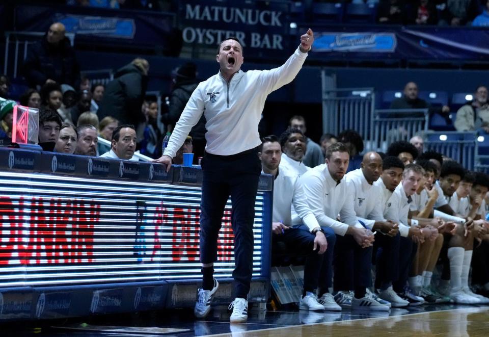 URI head coach Archie Miller directs his players from the sideline.