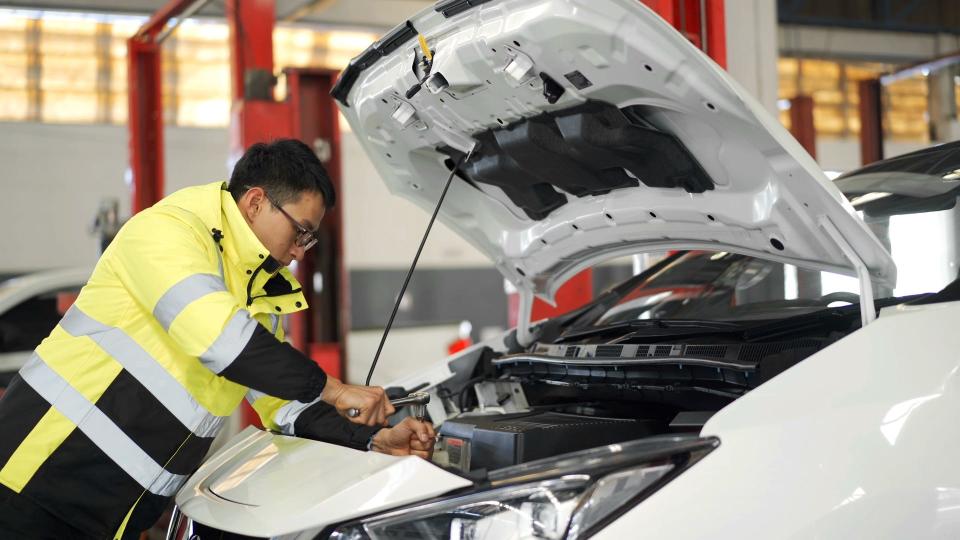 A technician makes repairs to an electric vehicle. As the Biden Administration announces a rise in tariffs on products imported from China to balance the global market, U.S. consumers could wind up paying for it.