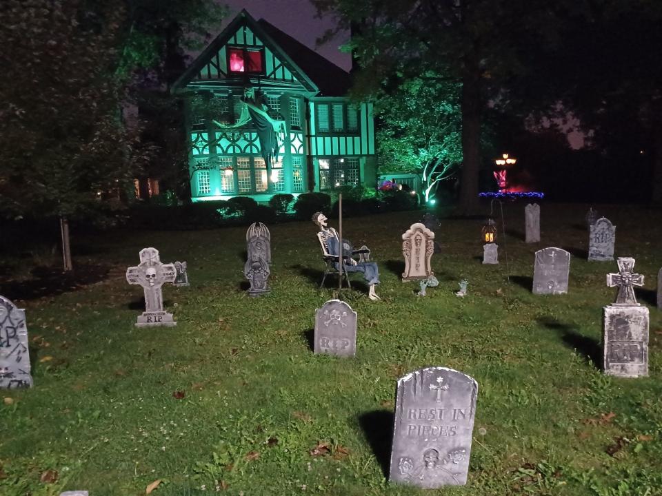 A spooky graveyard for Halloween decorates the gated Tudor Rose home in the 2000 block of Market Avenue N in Canton.