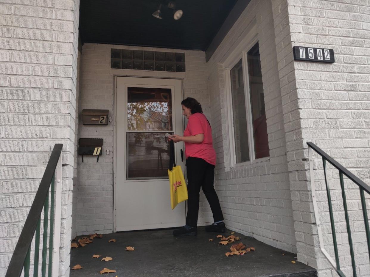 Planned Parenthood Votes canvasser Karen Meising Toth goes door to door in a neighborhood of Pittsburgh, Pennsylvania on Wednesday, November 2, 2022 in an effort to turn out pro-choice voters for the midterm elections.