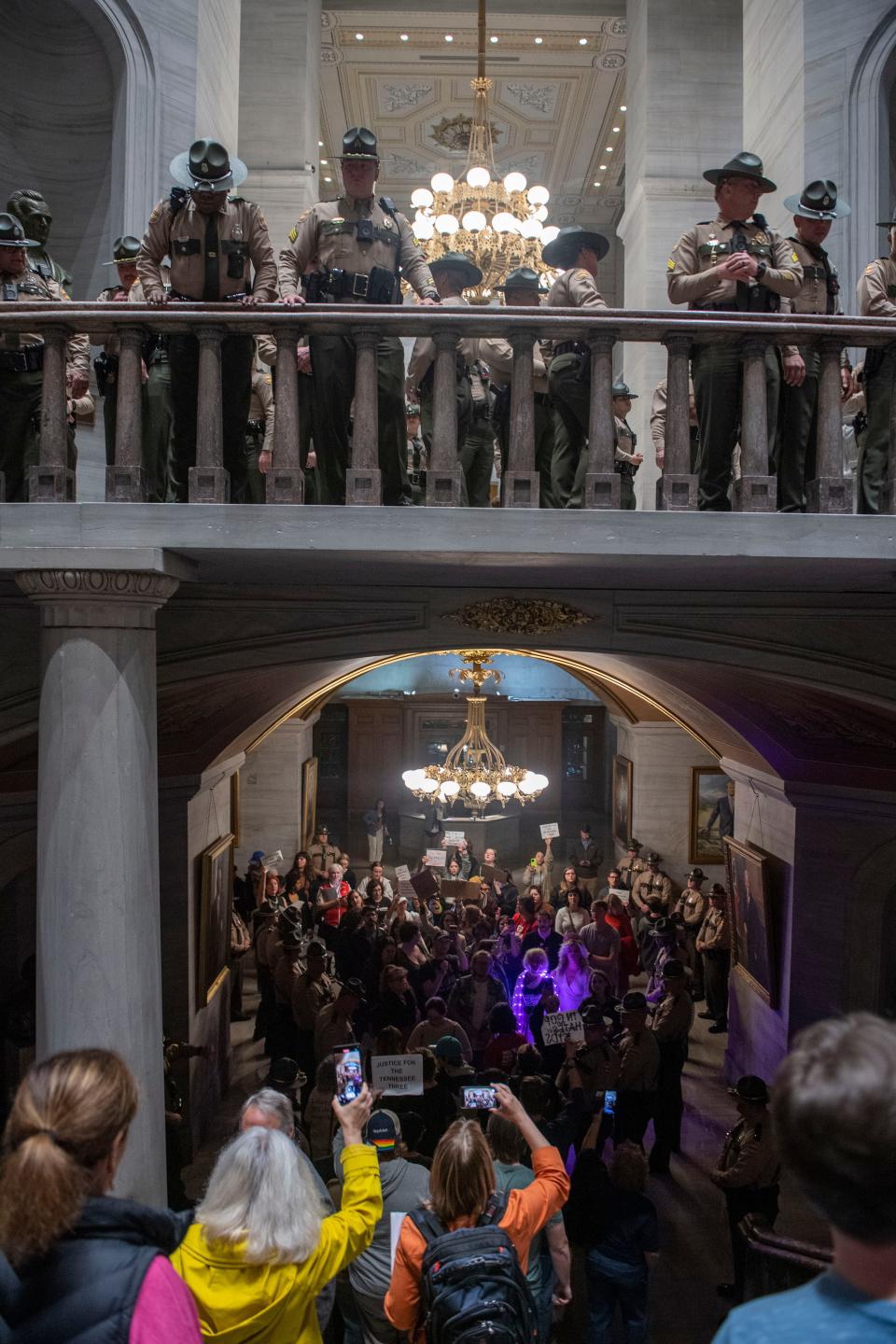 State Troopers escort the crowd to move to the lower level while people react after it was announced Republicans began the process of expelling Democratic Reps. Justin Pearson of Memphis, Rep. Justin Jones of Nashville, and Rep. Gloria Johnson of Knoxville, during a House session  at Tennessee state Capitol Building in Nashville , Tenn., Monday, April 3, 2023. 