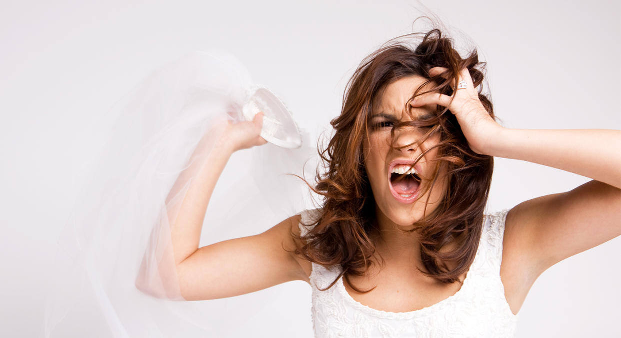 Brides can sometimes act of character during the wedding planning process. [Photo: Getty]