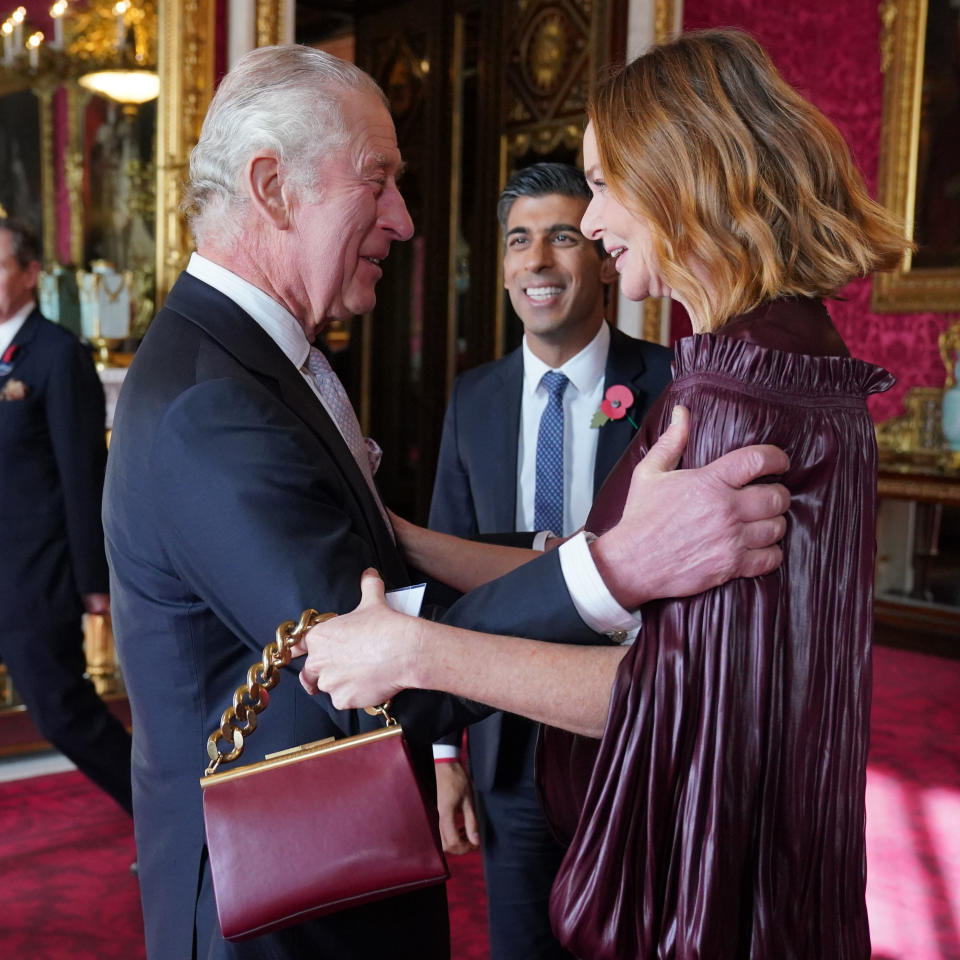 Britain's King Charles III (L) speaks with Britain's Prime Minister Rishi Sunak (2nd L) and British fashion designer Stella McCartney (R) during a reception at Buckingham Palace ahead of the Cop27 Summit on November 4, 2022, in London, England. King Charles III will miss the gathering of world figures in Egypt next week but is likely to discuss issues around Cop27 and climate change with those invited to his royal residence. (Photo by Jonathan Brady - Pool/Getty Images)