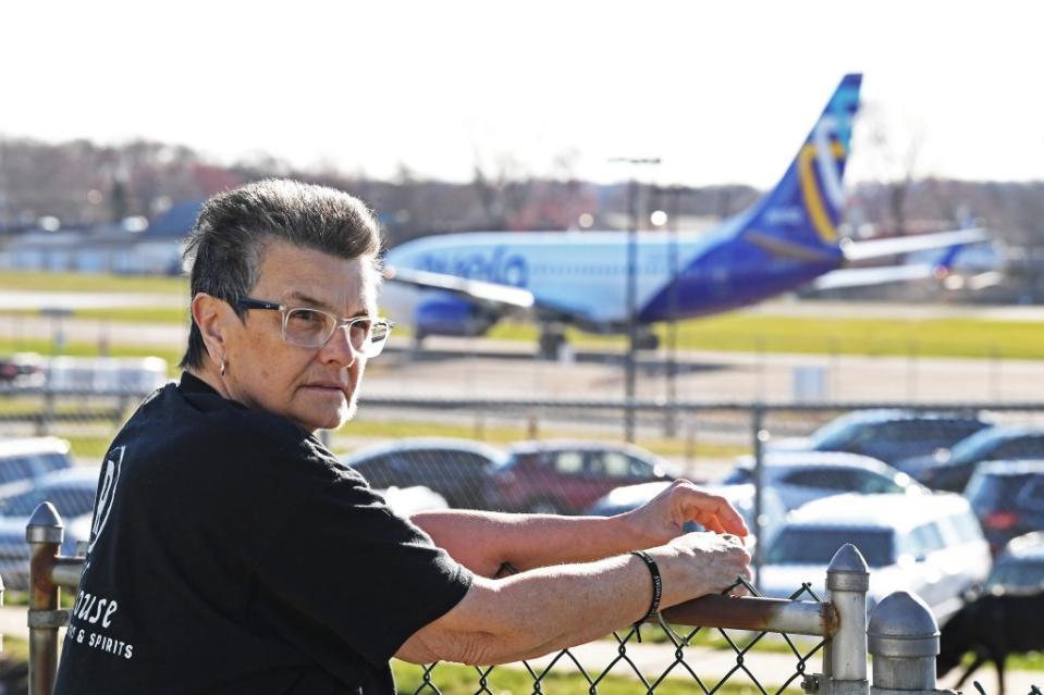 Homeowner Laura McHugh has lived across from the airport for decades, and sees the planes idle on the runway from her windows. Matthew McDermott