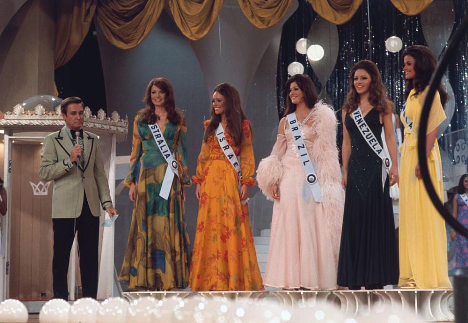 <p>Kerry Anne Wells was the first contestant to win a Miss Universe title for Australia. She is pictured here with the Bob Barker and the runners-up. </p>