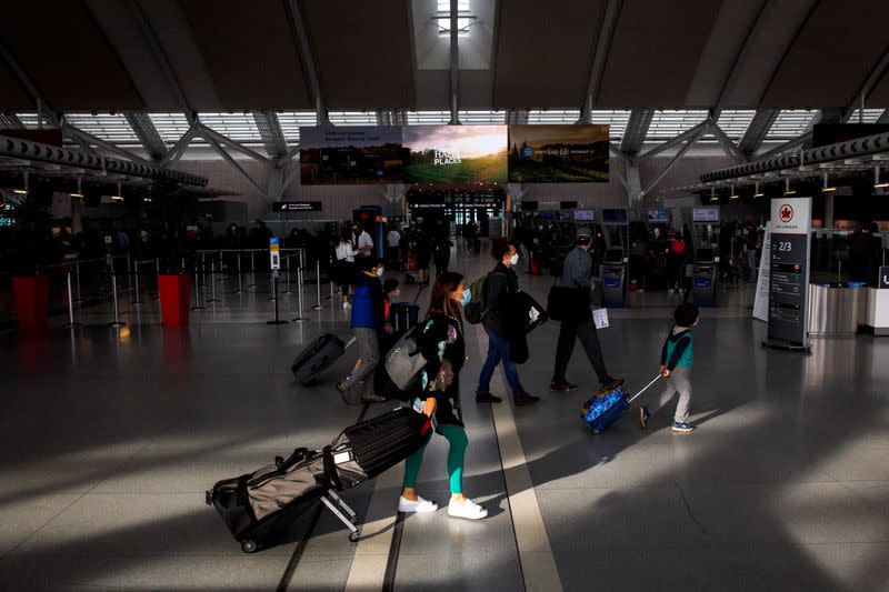 Travellers crowd the departures lounge at Toronto Pearson International Airport in Mississauga