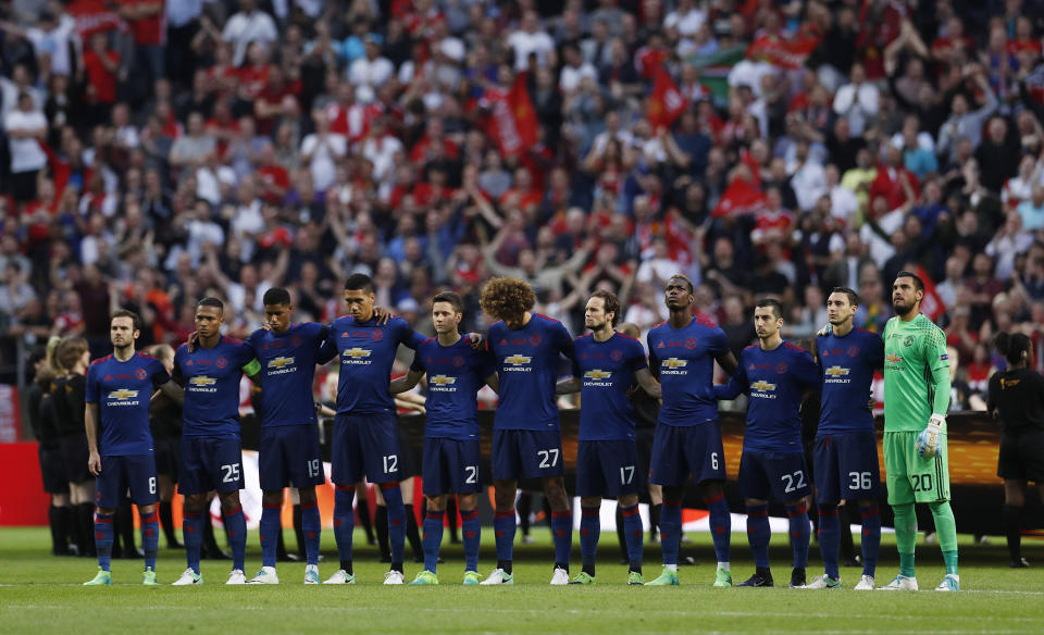 <p>Manchester United players observe a minute of silence in tribute to the victims of the Manchester attack during the UEFA Europa League Final in Stockholm, Sweden on May 24, 2017. (Photo: Andrew Couldridge Livepic/Reuters) </p>