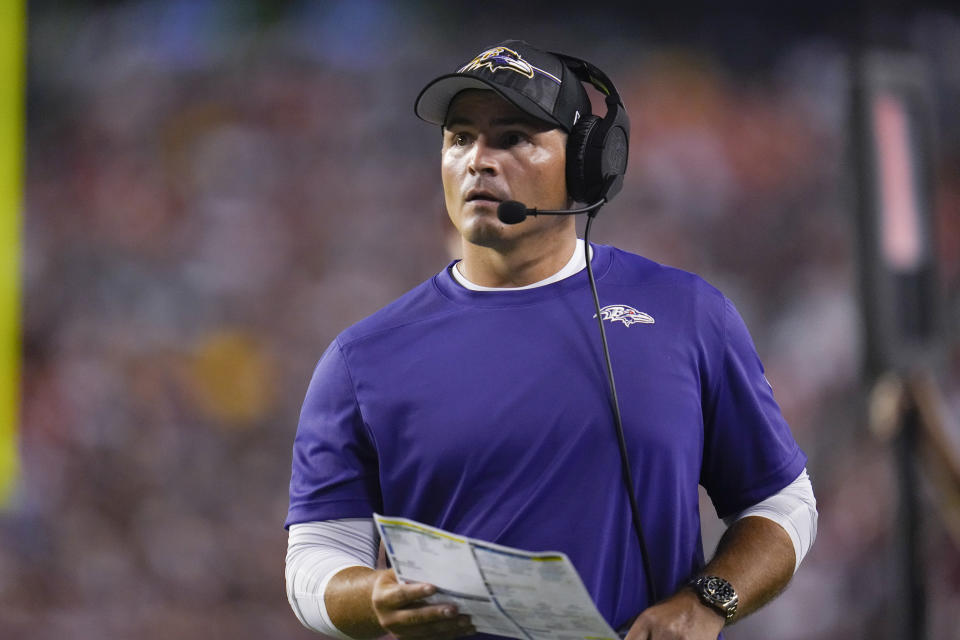 FILE - Baltimore Ravens defensive coordinator Mike Macdonald watches during the first half of the team's NFL preseason football game against the Washington Commanders on Aug. 21, 2023, in Landover, Md. The Atlanta Falcons have made Macdonald, a former University of Georgia assistant, their first interview in their search to replace fired coach Arthur Smith. The Falcons said Friday night, Jan . 23, 2024, that the team had had a virtual interview with Macdonald. (AP Photo/Julio Cortez, File)