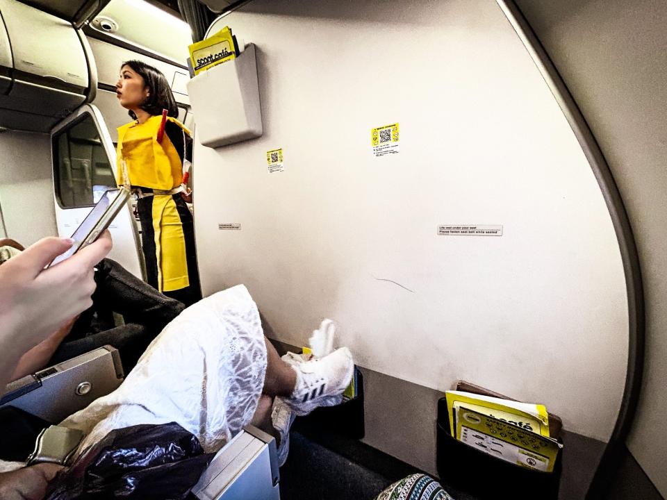 A photo showing the legroom in a front-row seat on a Scoot airplane.