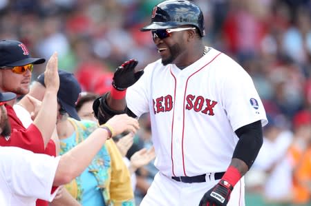 FILE PHOTO: Boston Red Sox designated hitter David Ortiz celebrates his solo home in the sixth inning against the Toronto Blue Jays during their MLB American League East baseball game in Boston