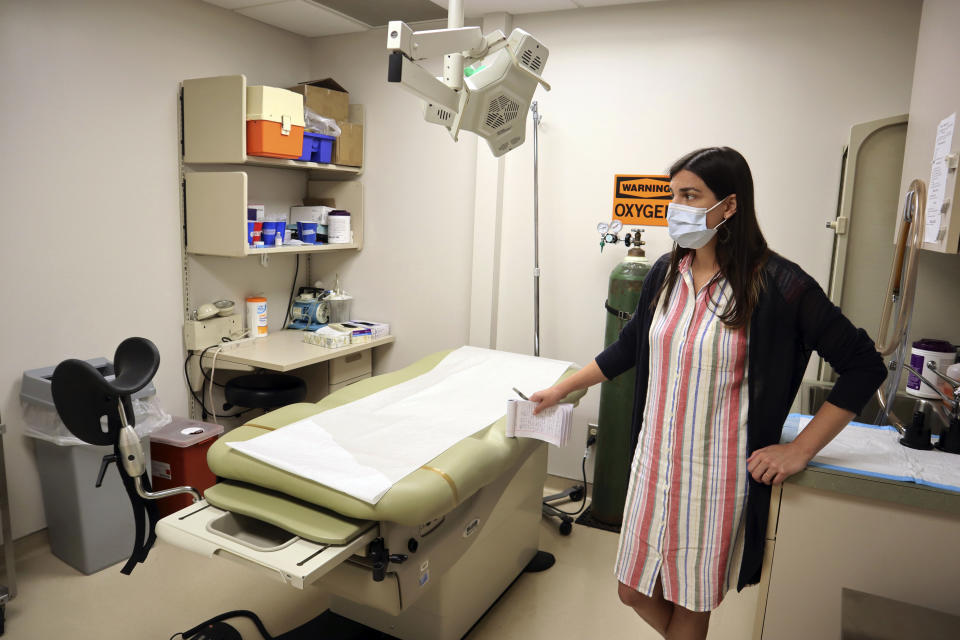 FILE - Chief Nurse Executive Danielle Maness stands in an empty examination room that was used to perform abortions at the Women's Health Center of West Virginia in Charleston, W.Va., June 29, 2022. A new abortion provider, the Women’s Health Center of Maryland, is opening this year in the Democratic-controlled state — just across from deeply conservative West Virginia, where state lawmakers recently passed a near-total abortion ban. (AP Photo/Leah Willingham, File)