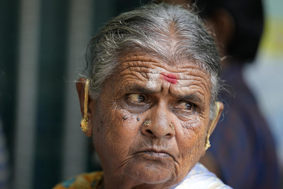 An elderly woman waits to cast her vote at a polling station in Bengaluru, India, Wednesday, May 10, 2023. People in the southern Indian state of Karnataka were voting Wednesday in an election where pre-poll surveys showed the opposition Congress party favored over Prime Minister Narendra Modi's governing Hindu nationalist party. (AP Photo/Aijaz Rahi)